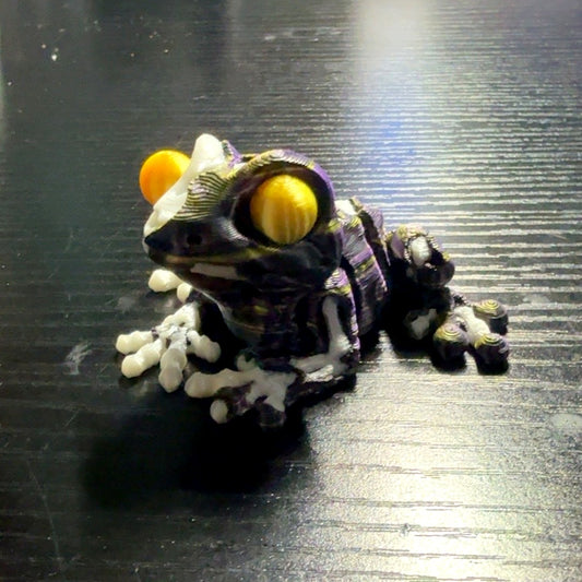 ZombieFrog articulated zombie frog in black with purple and gold swirl color scheme