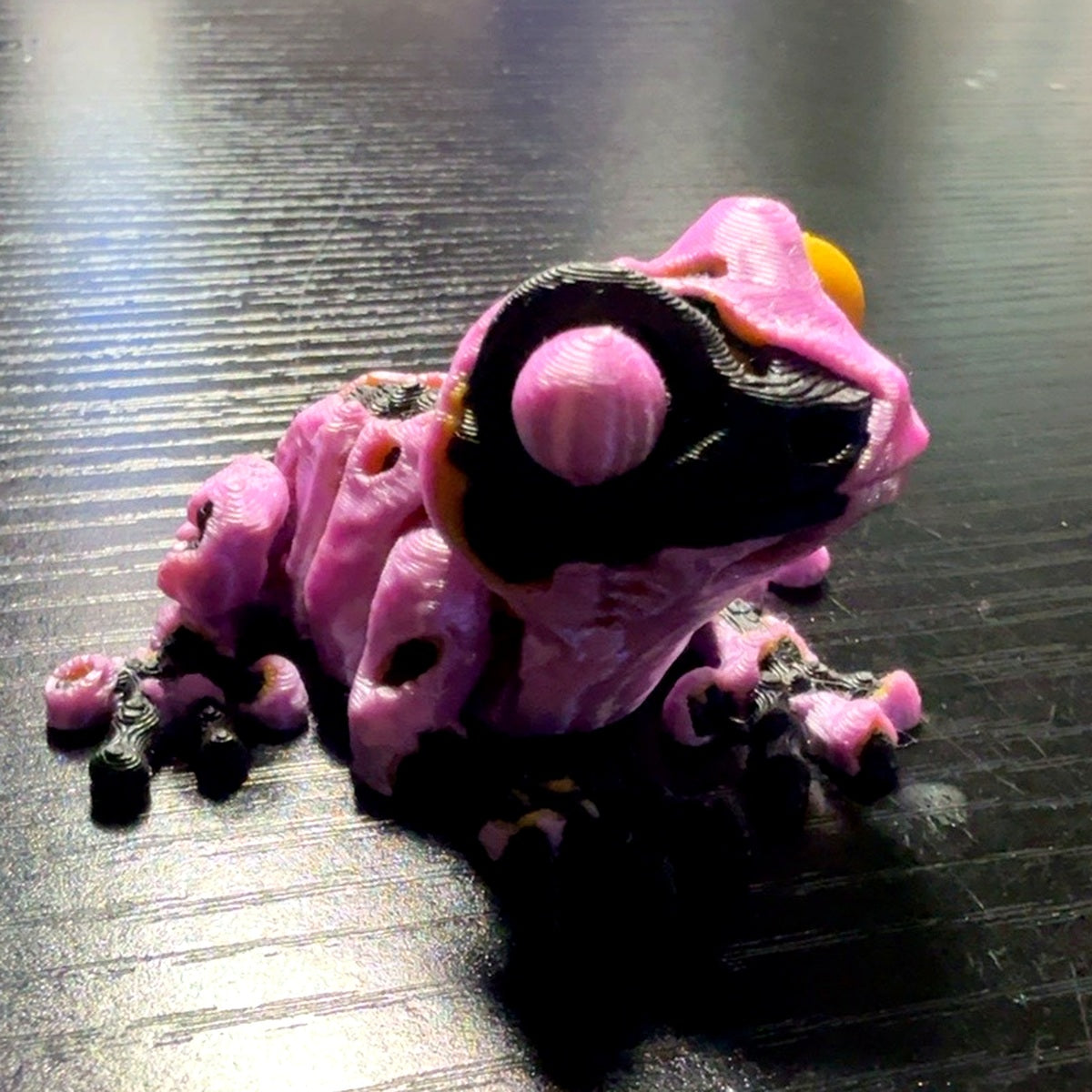ZombieFrog articulated zombie frog in pink and black color scheme, alternate angle